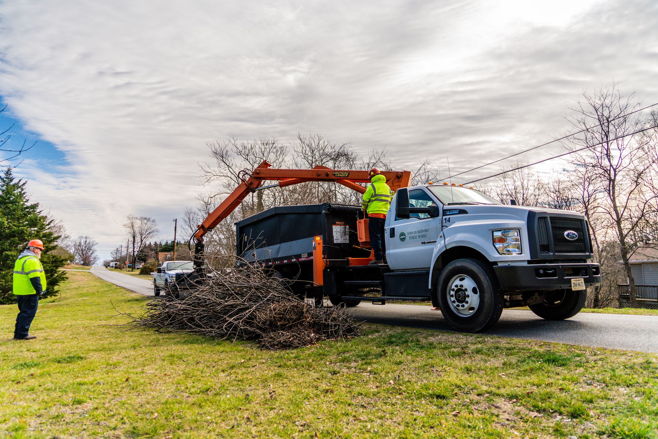 Truck picking up brush