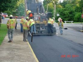 Staff Laying Down Asphalt